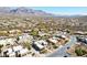 Expansive aerial view showcases an upscale community nestled amongst desert landscaping near majestic mountains at 9870 E Little Nugget Way, Gold Canyon, AZ 85118