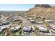 Stunning aerial view of luxury homes with pools in a desert community nestled against a mountain backdrop at 9870 E Little Nugget Way, Gold Canyon, AZ 85118