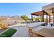 Relaxing outdoor area with a covered patio, bar, and a swimming pool with lounge chairs at 9870 E Little Nugget Way, Gold Canyon, AZ 85118