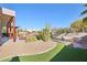 Expansive backyard featuring a patio, built-in seating, barbecue area, desert landscaping, and mountain views at 9870 E Little Nugget Way, Gold Canyon, AZ 85118