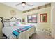 Brightly colored bedroom with decoratively painted walls and decorative objects on display shelves at 9870 E Little Nugget Way, Gold Canyon, AZ 85118