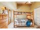 Fun bunk room with exposed ceiling beams and private door to outdoor recreation area at 9870 E Little Nugget Way, Gold Canyon, AZ 85118