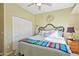 Comfortable bedroom featuring a ceiling fan, closet, and decorative sun accent at 9870 E Little Nugget Way, Gold Canyon, AZ 85118