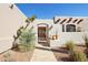 Charming entryway with an arched gate, desert foliage, and terracotta accents at 9870 E Little Nugget Way, Gold Canyon, AZ 85118