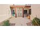 Inviting entrance featuring a brick paver patio, decorative cacti, and a covered porch at 9870 E Little Nugget Way, Gold Canyon, AZ 85118