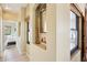 Hallway with arched niches, decorative accents, and views into a bedroom at 9870 E Little Nugget Way, Gold Canyon, AZ 85118