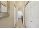 Hallway with multiple closets and access to the laundry room at 9870 E Little Nugget Way, Gold Canyon, AZ 85118