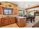 Kitchen featuring stainless steel appliances, wooden cabinets and mountain views at 9870 E Little Nugget Way, Gold Canyon, AZ 85118