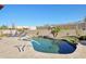 Resort-style pool area with lush desert landscaping, lounge chairs, and mountain views, perfect for relaxation at 9870 E Little Nugget Way, Gold Canyon, AZ 85118