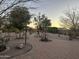 Picture-perfect backyard with intricate brick pathway and beautiful landscape at 10731 W Wikieup Ln, Peoria, AZ 85373