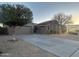 A lovely exterior view of the home, featuring a well-maintained lawn and attached garage at 10731 W Wikieup Ln, Peoria, AZ 85373