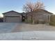 Charming single-story home with a well-manicured yard and covered entryway at 10731 W Wikieup Ln, Peoria, AZ 85373