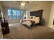 Bright bedroom with natural light, a large bed, and neutral decor at 10731 W Wikieup Ln, Peoria, AZ 85373