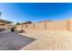 Spacious backyard with desert landscaping, and a covered patio, ideal for low-maintenance outdoor living at 11026 E Nopal Ave, Mesa, AZ 85209