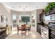 Bright breakfast nook featuring natural light and a view of the front yard at 11026 E Nopal Ave, Mesa, AZ 85209