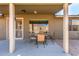 Enjoy outdoor dining on this covered patio with a table and chairs, perfect for entertaining guests at 11026 E Nopal Ave, Mesa, AZ 85209