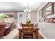 Dining room featuring a wooden table with seating for four with decor mirror at 11026 E Nopal Ave, Mesa, AZ 85209