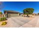 Beautiful single-story home featuring a spacious driveway and desert landscaping at 11026 E Nopal Ave, Mesa, AZ 85209