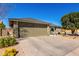 Beautiful single-story home featuring a spacious driveway and desert landscaping at 11026 E Nopal Ave, Mesa, AZ 85209