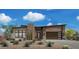 Beautiful home featuring desert landscaping, a two-car garage, and a stone accent wall at 12322 E Black Rock Rd, Scottsdale, AZ 85255