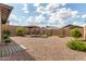 Spacious backyard featuring a charming gazebo and drought-tolerant landscaping, perfect for outdoor enjoyment at 13224 W Crimson Ter, Peoria, AZ 85383