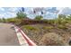 Welcoming entrance to the community with stone signage and desert landscaping at 13224 W Crimson Ter, Peoria, AZ 85383