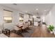 Open-concept dining area with a view of the kitchen, featuring modern decor at 13224 W Crimson Ter, Peoria, AZ 85383