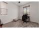 Functional home office with a minimalist desk setup, providing a dedicated workspace in a well-lit and quiet environment at 13224 W Crimson Ter, Peoria, AZ 85383