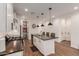 Spacious kitchen with an island, bar seating, and modern pendant lighting at 13224 W Crimson Ter, Peoria, AZ 85383