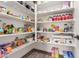 Walk-in pantry with ample shelving and storage space for all your needs at 13224 W Crimson Ter, Peoria, AZ 85383