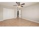 This bedroom has spacious closets and tile floor at 13232 N 40Th Pl, Phoenix, AZ 85032