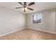 Cozy bedroom featuring tile flooring, ceiling fan, and natural light at 13232 N 40Th Pl, Phoenix, AZ 85032