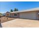 Single-story home with a two-car garage and a large driveway for easy parking at 13232 N 40Th Pl, Phoenix, AZ 85032