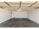 Spacious garage with concrete flooring and overhead lighting at 13232 N 40Th Pl, Phoenix, AZ 85032