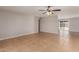 Spacious living room with tile flooring, neutral paint, and sliding glass door at 13232 N 40Th Pl, Phoenix, AZ 85032