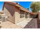 View of the cozy backyard featuring lush landscaping and a brick-paved patio for outdoor enjoyment at 13425 N 92Nd Pl, Scottsdale, AZ 85260