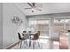 Cozy dining area with a modern table set, sliding door access to the patio, and tile flooring at 13425 N 92Nd Pl, Scottsdale, AZ 85260