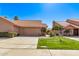 Charming single-story home featuring a well-manicured lawn, mature landscaping, and a two-car garage at 13425 N 92Nd Pl, Scottsdale, AZ 85260