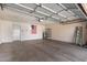 Spacious two-car garage with epoxy flooring, water heater, and plenty of storage space at 13425 N 92Nd Pl, Scottsdale, AZ 85260