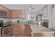 Functional kitchen featuring granite countertops, stainless steel appliances, and wood cabinetry at 13425 N 92Nd Pl, Scottsdale, AZ 85260