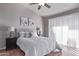 Serene main bedroom with a large window, neutral decor, and comfortable furnishings at 13425 N 92Nd Pl, Scottsdale, AZ 85260