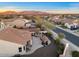 Stunning aerial view showcasing the backyard, outdoor bar, and lush neighborhood at 13583 S 177Th Ln, Goodyear, AZ 85338