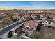 A captivating aerial view of the home, highlighting the backyard patio and mountain views in the distance at 13583 S 177Th Ln, Goodyear, AZ 85338