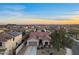 Expansive view of a desert neighborhood with mountain views and solar panels at 13583 S 177Th Ln, Goodyear, AZ 85338