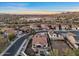 Wide aerial view of a desert community highlighting tile roofs, single Gathering homes, and desert landscaping at 13583 S 177Th Ln, Goodyear, AZ 85338