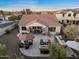 Wide backyard featuring built in outdoor kitchen, gas fire pit with ample seating, and covered patio at 13583 S 177Th Ln, Goodyear, AZ 85338