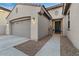 Inviting home featuring a two-car garage and a stylish front door, complemented by desert landscaping at 13583 S 177Th Ln, Goodyear, AZ 85338