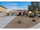 Well-maintained single-story home with a neutral color palette, three-car garage, and low-maintenance landscaping at 13583 S 177Th Ln, Goodyear, AZ 85338