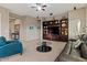 Spacious living room featuring built-in shelving and a neutral color palette at 13583 S 177Th Ln, Goodyear, AZ 85338