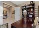 Home office showcasing built-in dark wood shelves, a bright window, and versatile workspace at 13583 S 177Th Ln, Goodyear, AZ 85338